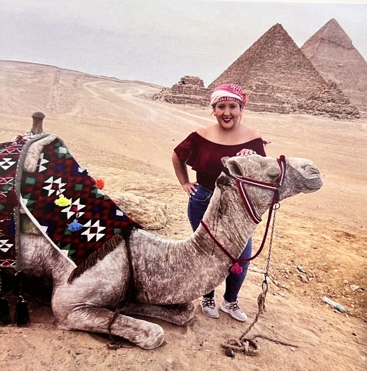 Senator Hurtado beside a camel in front of the pyramids of Giza